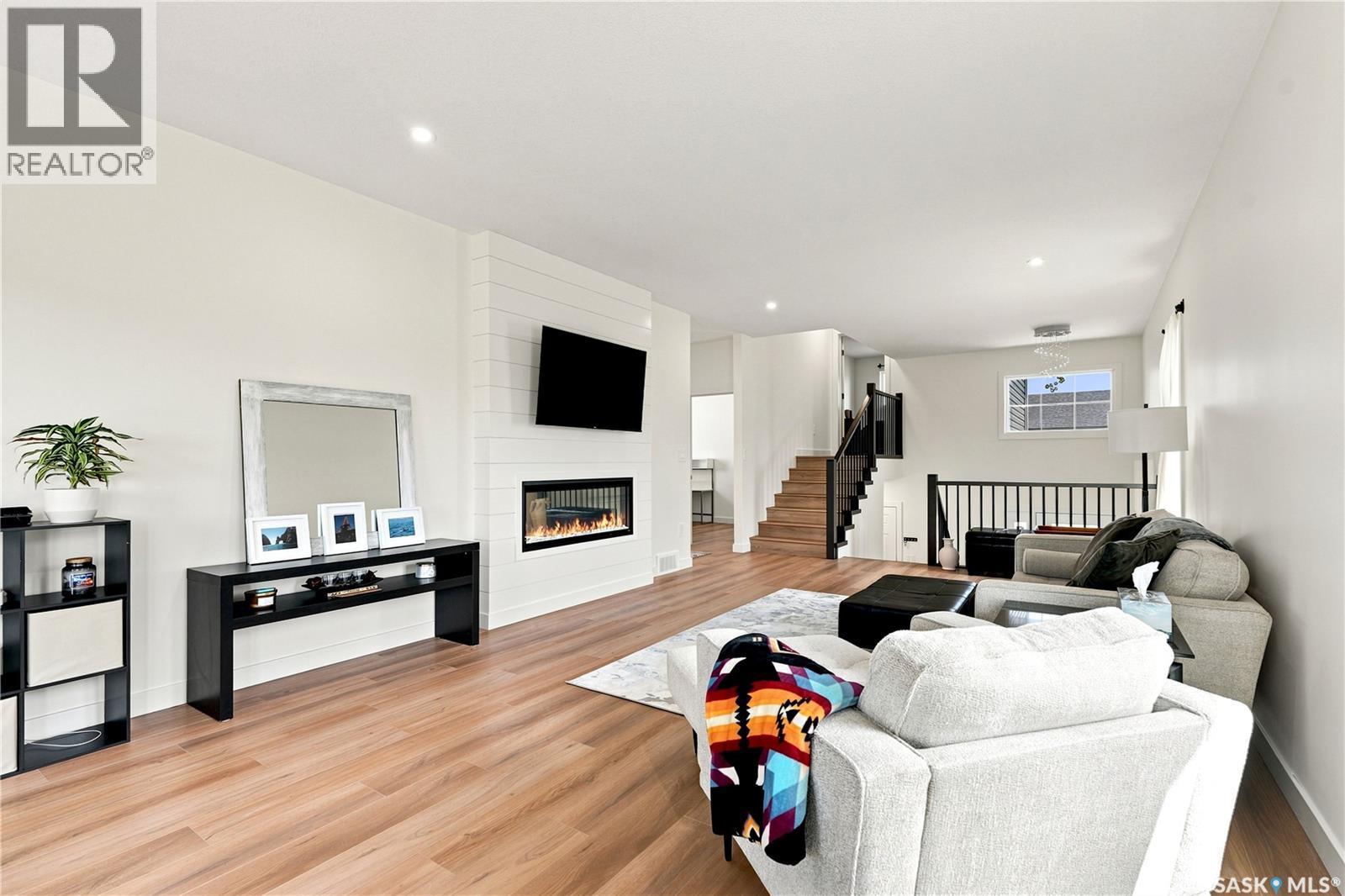 902 Bentley Manor, Saskatoon, SK - Indoor Photo Showing Living Room With Fireplace