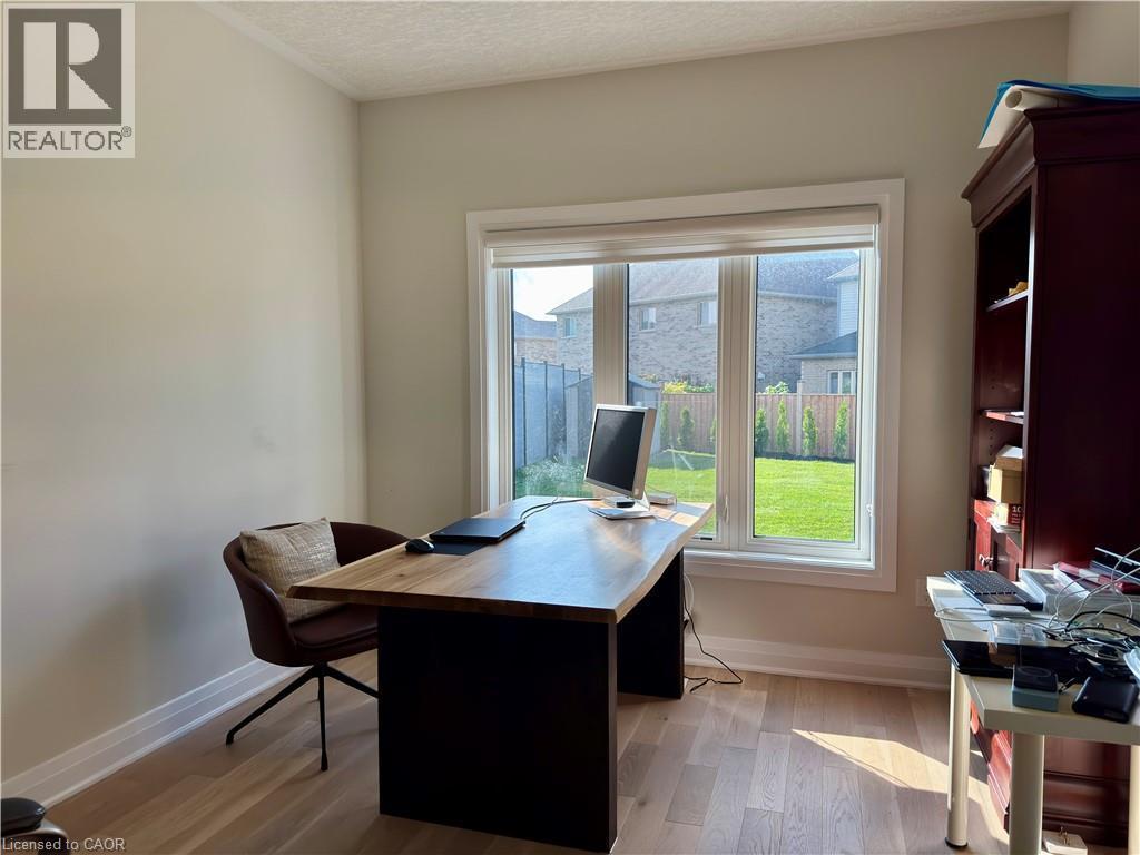 Hardwood-style flooring, large window with backyard visibility, - 923 Eaglecrest Court, Kitchener, ON - Indoor Photo Showing Office