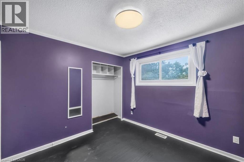 Recessed open shelving within the closet provides storage - 27 Gretna Court, Hamilton, ON - Indoor