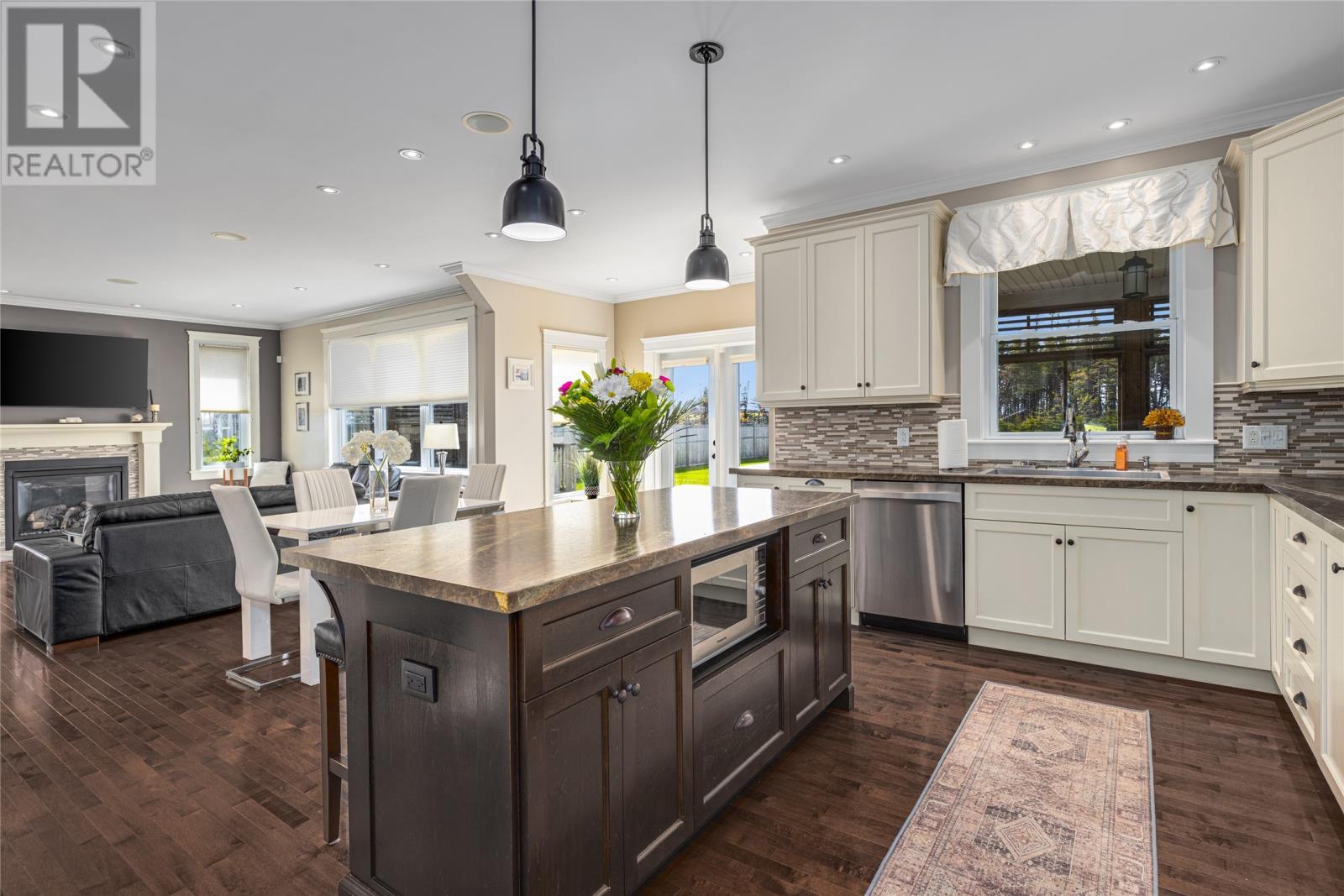15 Flora Drive, Torbay, NL - Indoor Photo Showing Kitchen With Fireplace With Upgraded Kitchen
