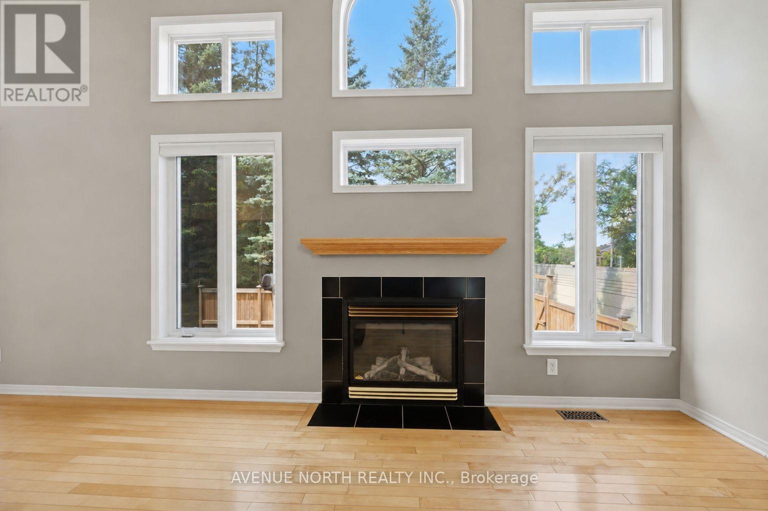 141 Gladeview Private, Ottawa, ON - Indoor Photo Showing Living Room With Fireplace