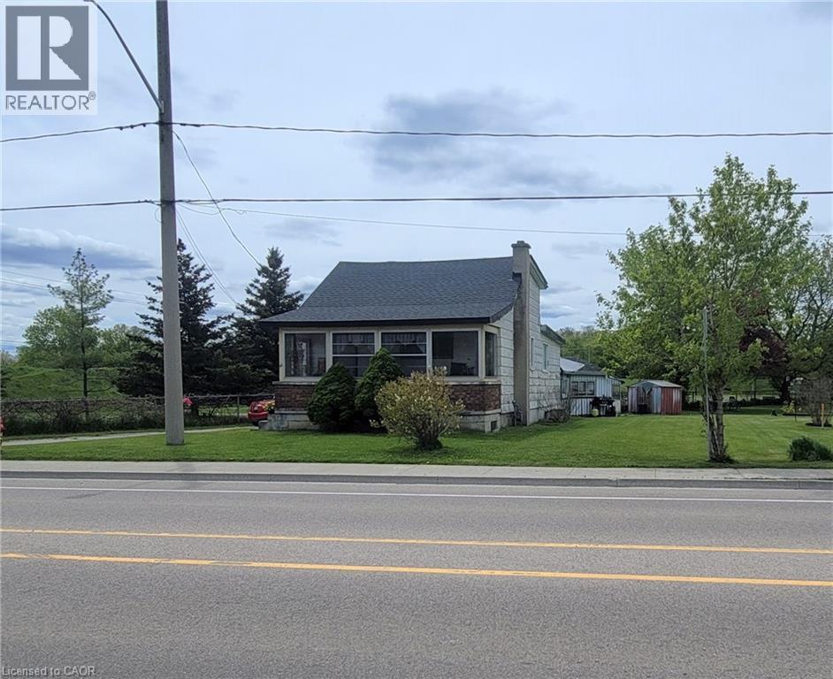 view of the current house that so there should be no lot levies and it is a serviced lot. - 46 Bridge Street E, Kitchener, ON