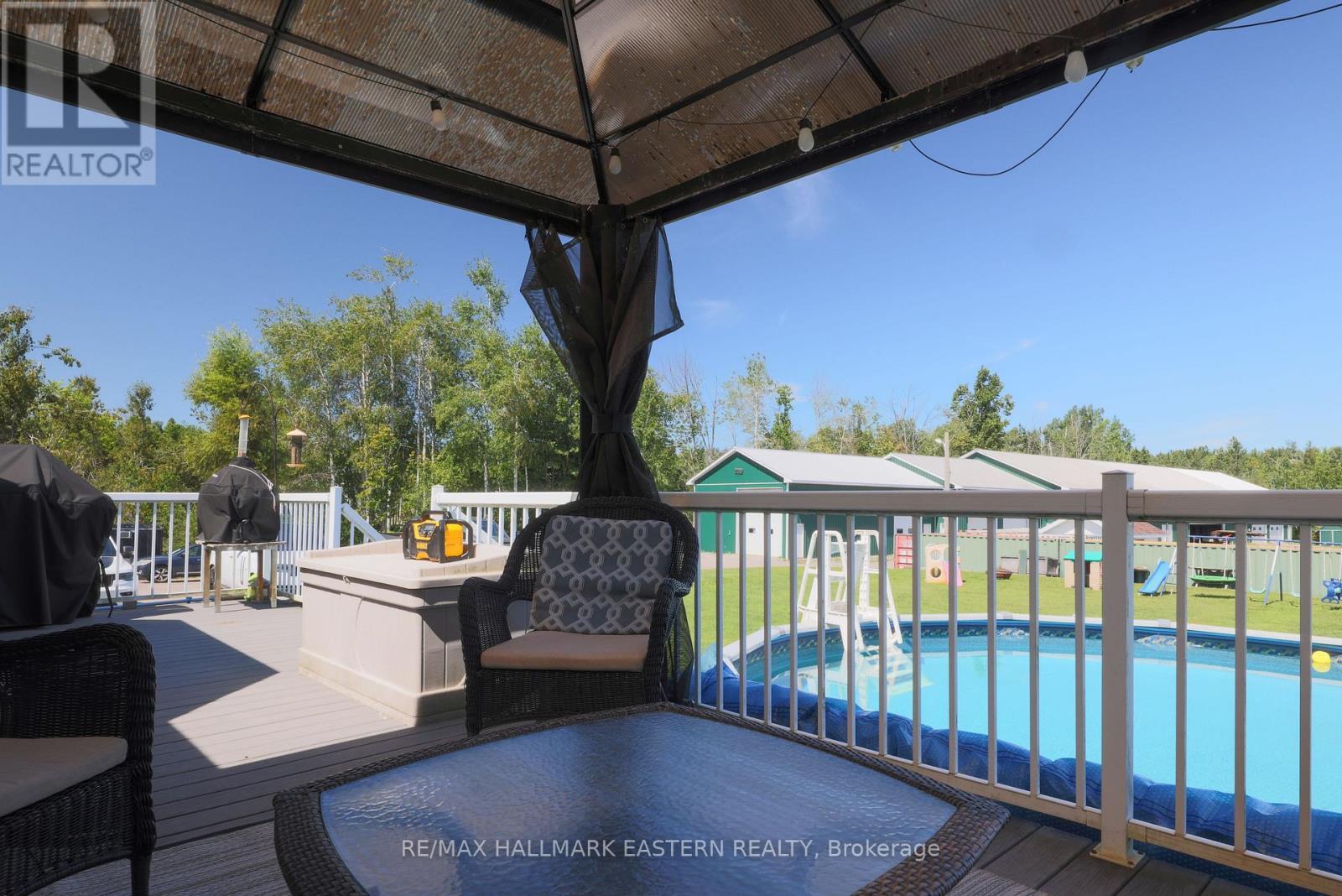 1738 8Th Line, Selwyn, ON - Outdoor With Above Ground Pool With Deck Patio Veranda With Exterior