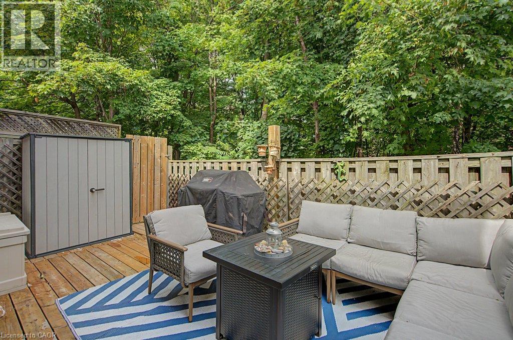 Wood deck featuring a storage shed and privacy fencing - 2050 Upper Middle Road Unit# 164, Burlington, ON - Outdoor With Deck Patio Veranda