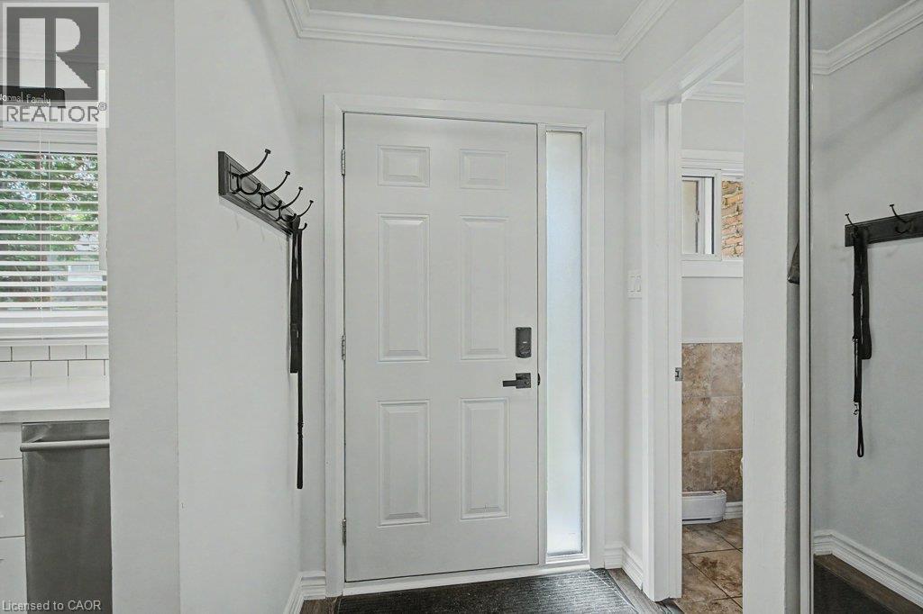White paneled entry door with frosted sidelight - 2050 Upper Middle Road Unit# 164, Burlington, ON - Indoor Photo Showing Other Room