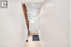White walls with light wood-finish flooring - 