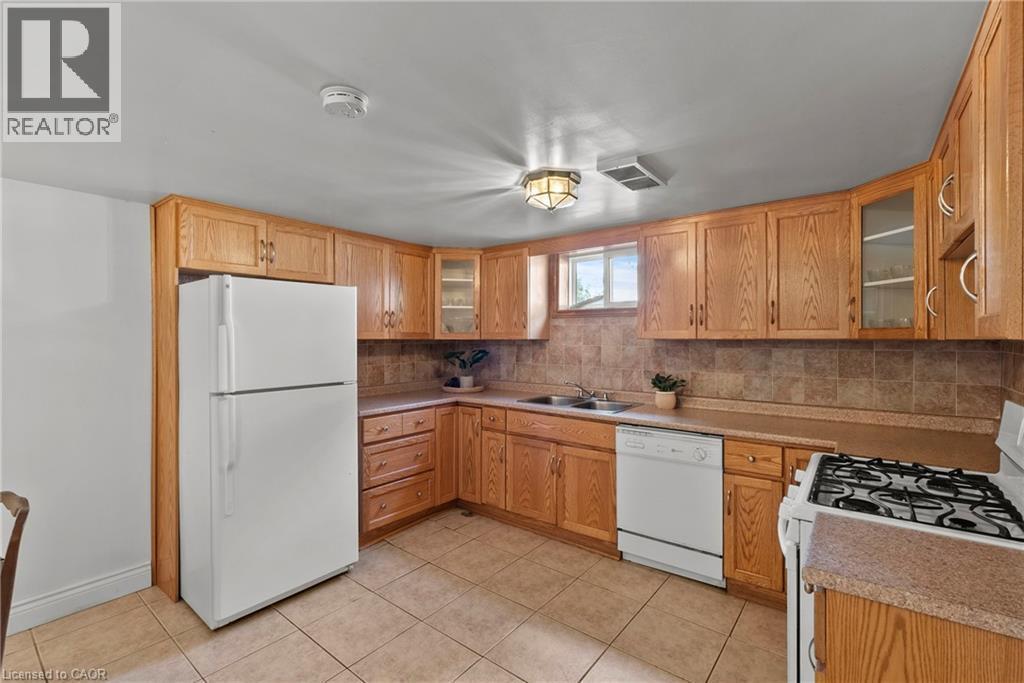 143 West 25Th Street, Hamilton, ON - Indoor Photo Showing Kitchen With Double Sink