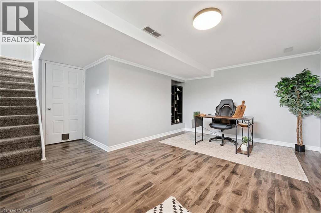 Wood-finish flooring, recessed shelving, and a flush-mount ceiling light - 308 Parkvale Drive, Kitchener, ON - Indoor