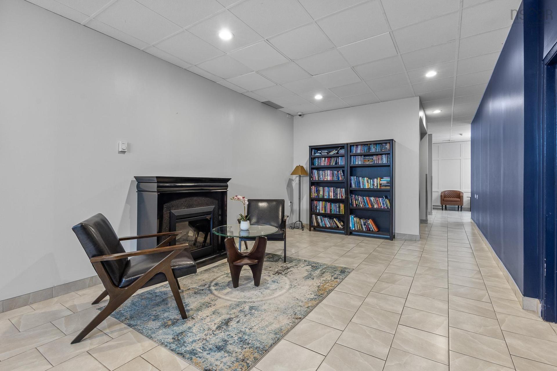 1002 5572 North Ridge Road, Halifax, NS - Indoor Photo Showing Other Room With Fireplace