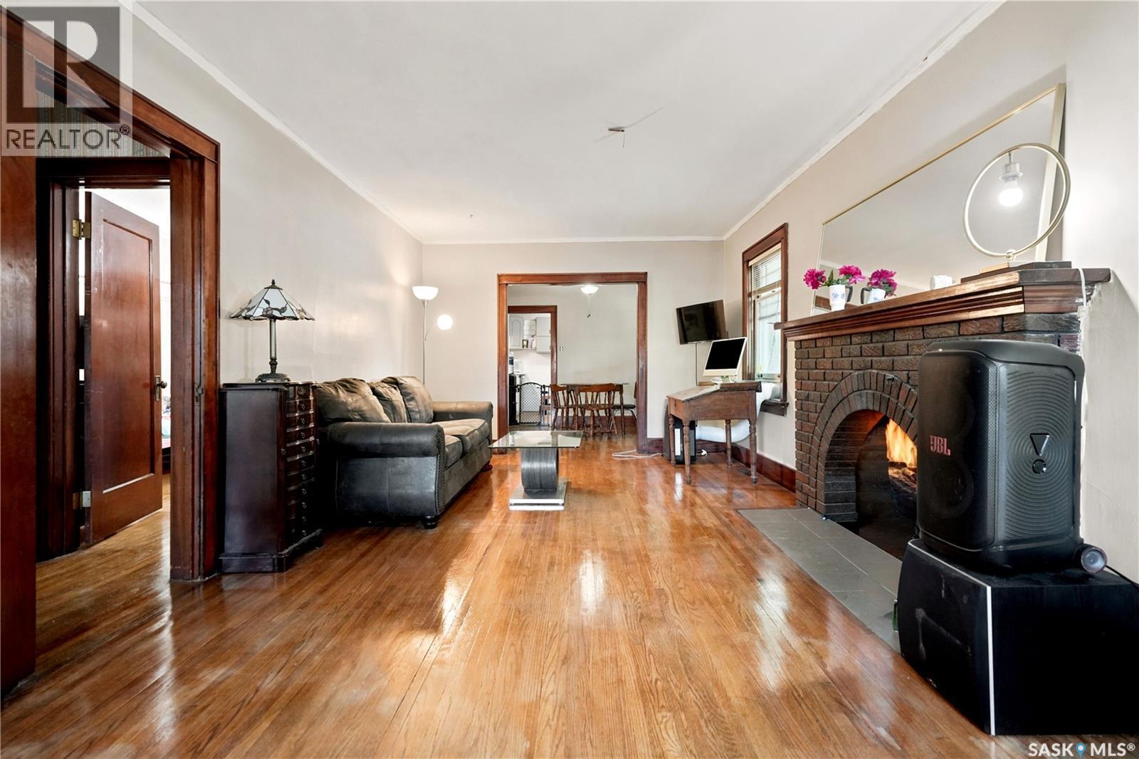 3300 Victoria Avenue, Regina, SK - Indoor Photo Showing Living Room With Fireplace