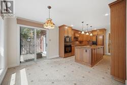 WALK-OUT TO RAVINE BACK YARD FROM KITCHEN - 