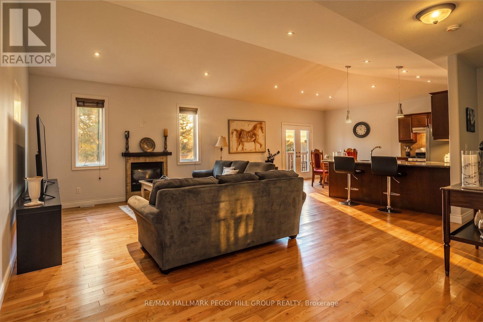 122 Trout Lane, Tiny, ON - Indoor Photo Showing Living Room With Fireplace
