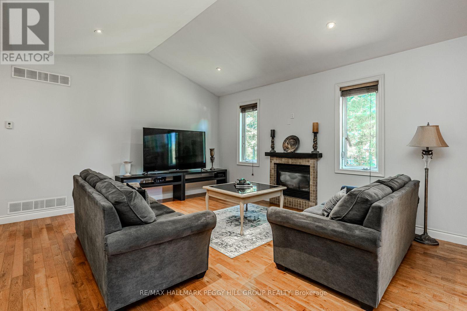 122 Trout Lane, Tiny, ON - Indoor Photo Showing Living Room With Fireplace