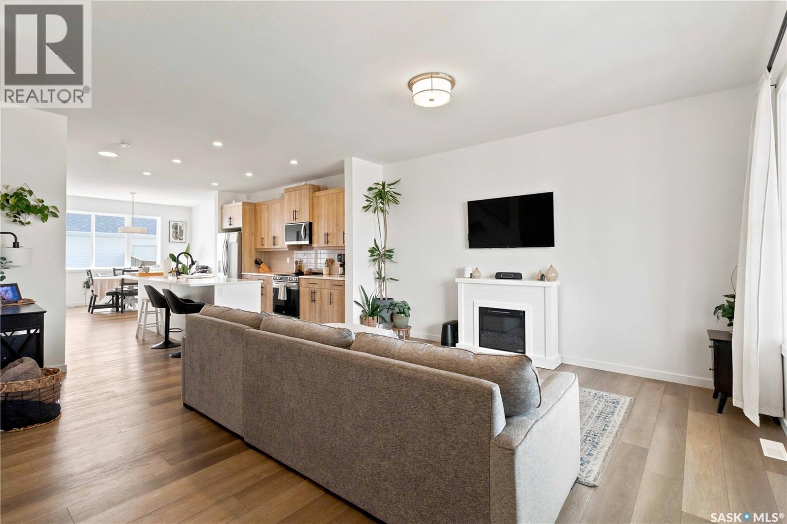 3089 Brighton Common, Saskatoon, SK - Indoor Photo Showing Living Room With Fireplace