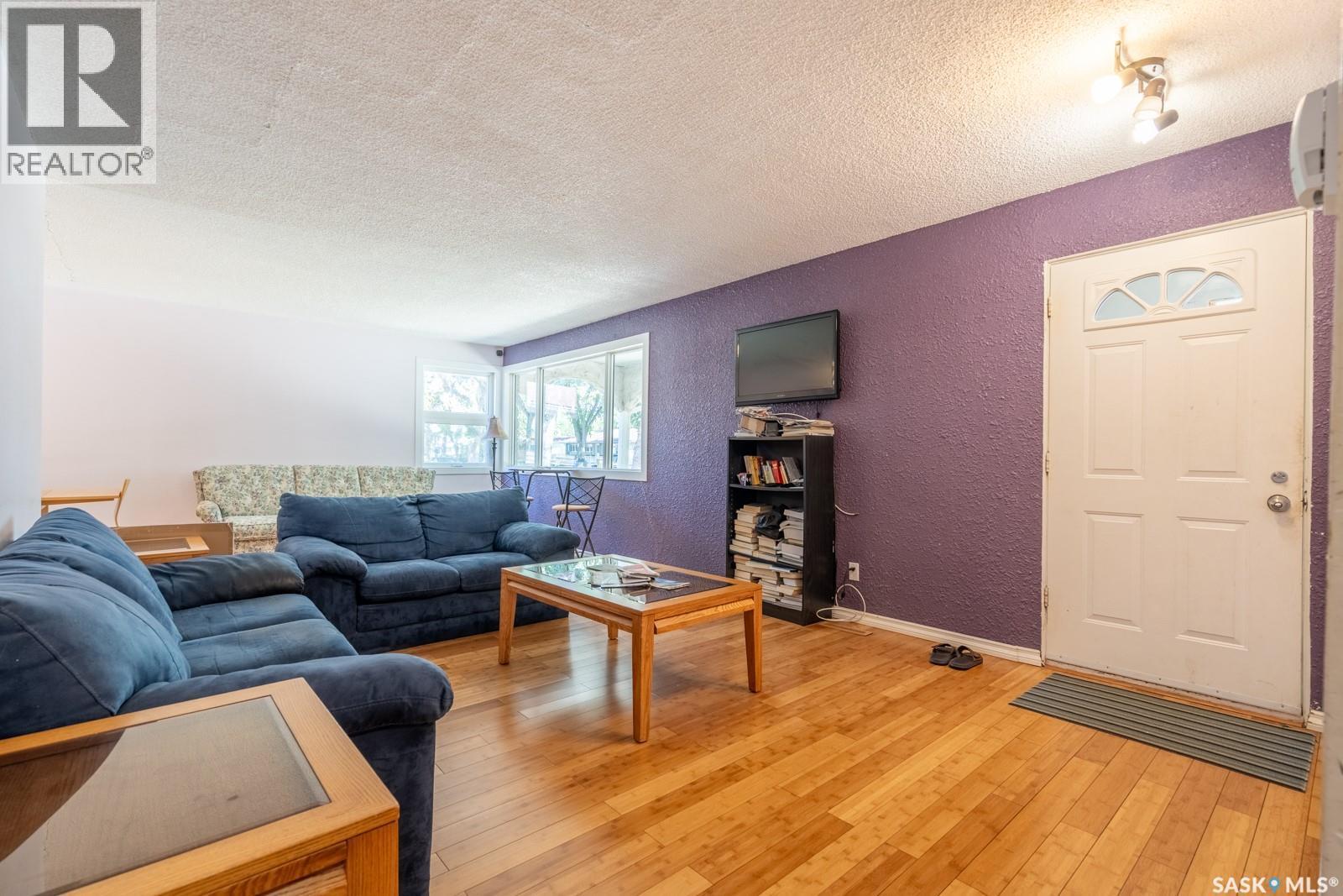 60 Dunning Crescent, Regina, SK - Indoor Photo Showing Living Room With Fireplace