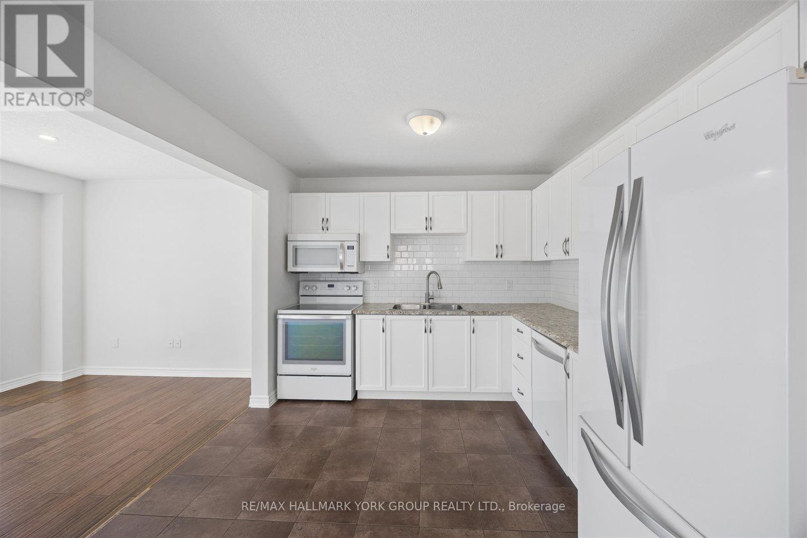 132 Banting Crescent, Essa, ON - Indoor Photo Showing Kitchen With Double Sink
