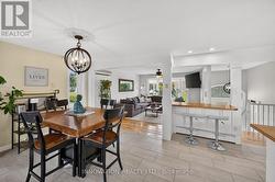 Dining area open to kitchen, with breakfast bar - 