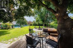 Backyard with deck, fire pit & inground pool - 