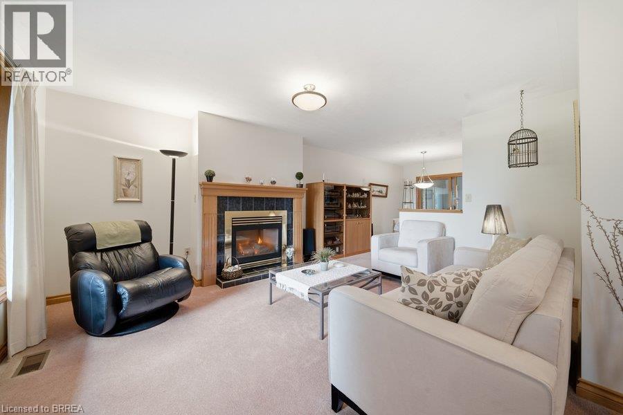 70 Thirteenth Street W, Simcoe, ON - Indoor Photo Showing Living Room With Fireplace