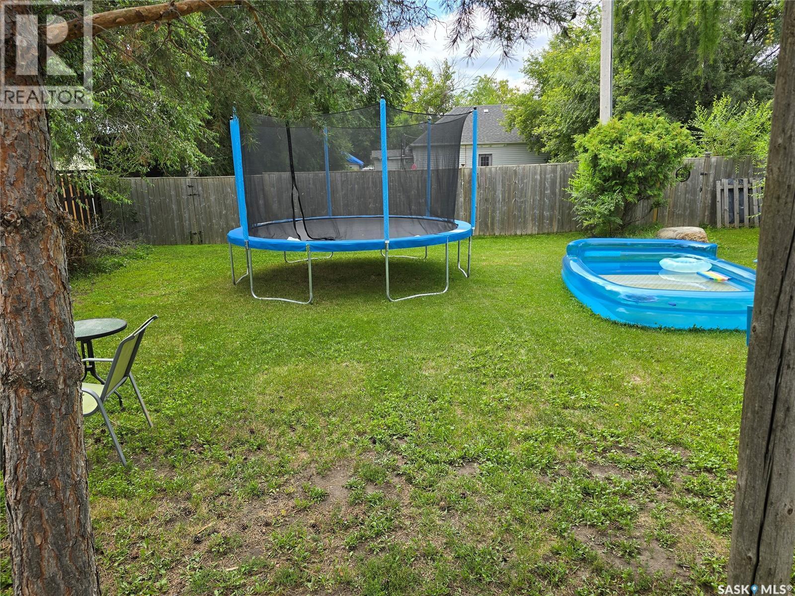 127 1St Avenue, Osler, SK - Outdoor With Above Ground Pool With Backyard