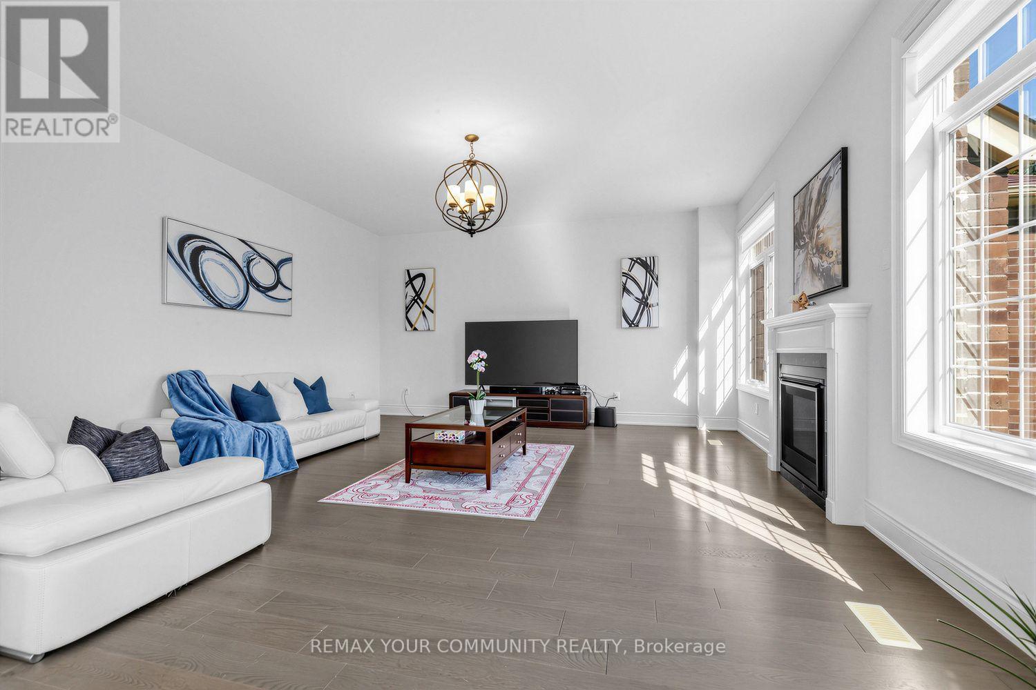 19 Redmond Crescent, Springwater, ON - Indoor Photo Showing Living Room With Fireplace