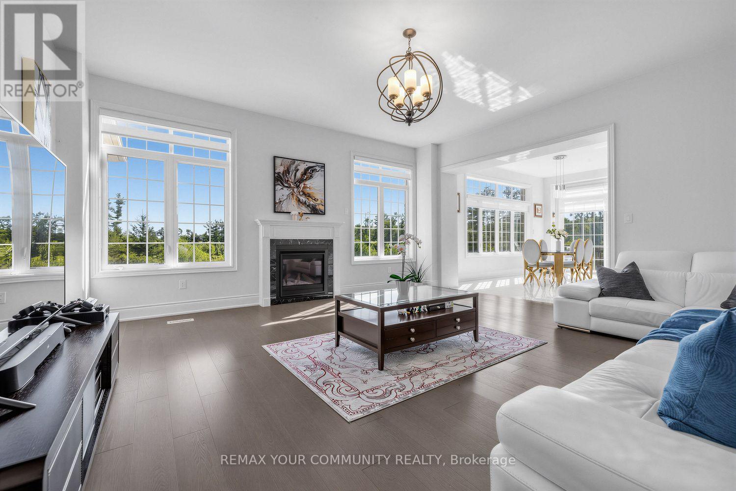 19 Redmond Crescent, Springwater, ON - Indoor Photo Showing Living Room With Fireplace
