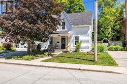 Lovely cottage curb appeal with private driveway. - 