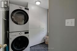 Main floor laundry room with tons of storage! - 