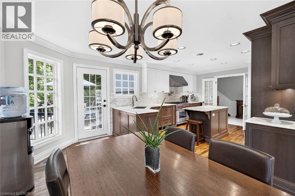 Gourmet kitchen featuring a central island, stainless steel appliances, custom cabinetry, and recessed lighting - 11 Christman Court, Markham, ON - Indoor