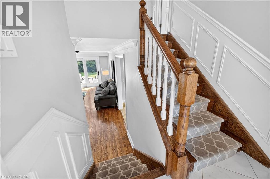 Hardwood flooring and decorative wall paneling - 11 Christman Court, Markham, ON - Indoor Photo Showing Other Room