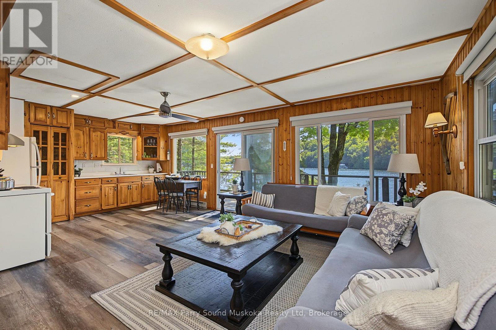 Open living, dining & kitchen areas w lake views - 4 Post Lane, Seguin, ON - Indoor Photo Showing Living Room