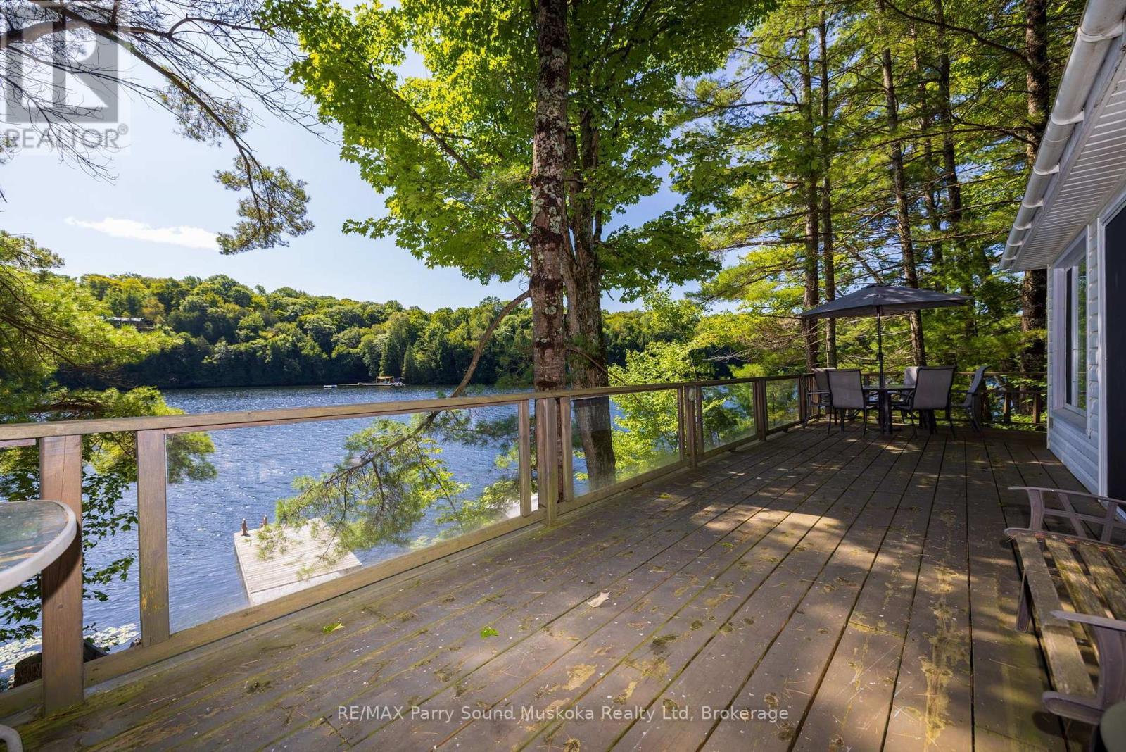 Large lakeside deck - 4 Post Lane, Seguin, ON - Outdoor With Body Of Water With Deck Patio Veranda