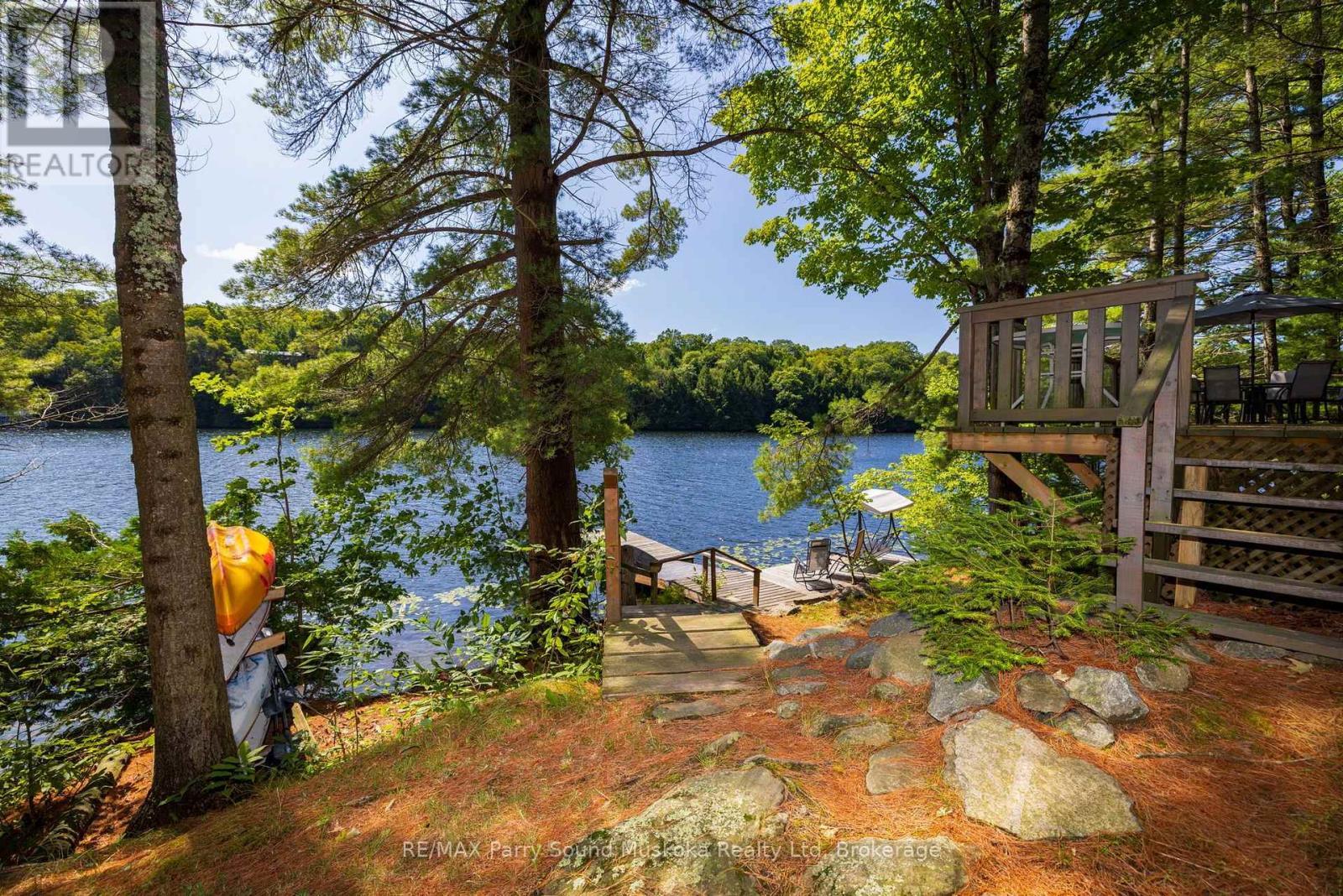 Nestled amongst the pines & natural rock landscape - 4 Post Lane, Seguin, ON - Outdoor With Body Of Water
