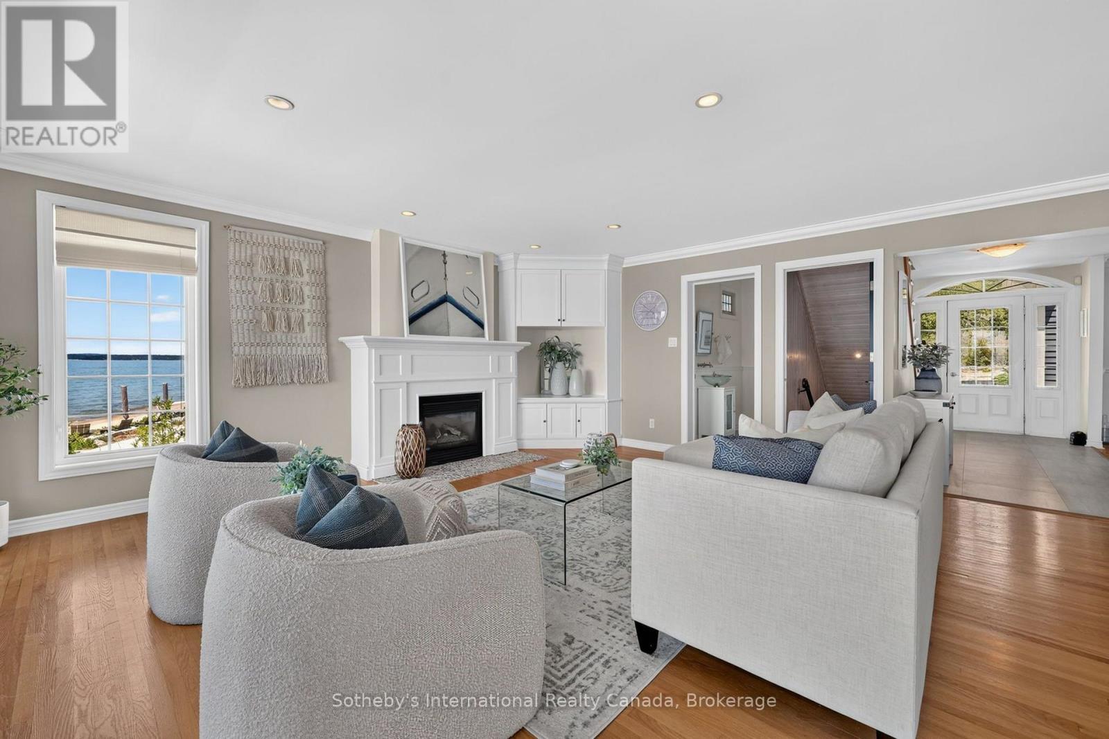 Living Room - 10 Lundy Lane, Tiny, ON - Indoor Photo Showing Living Room With Fireplace