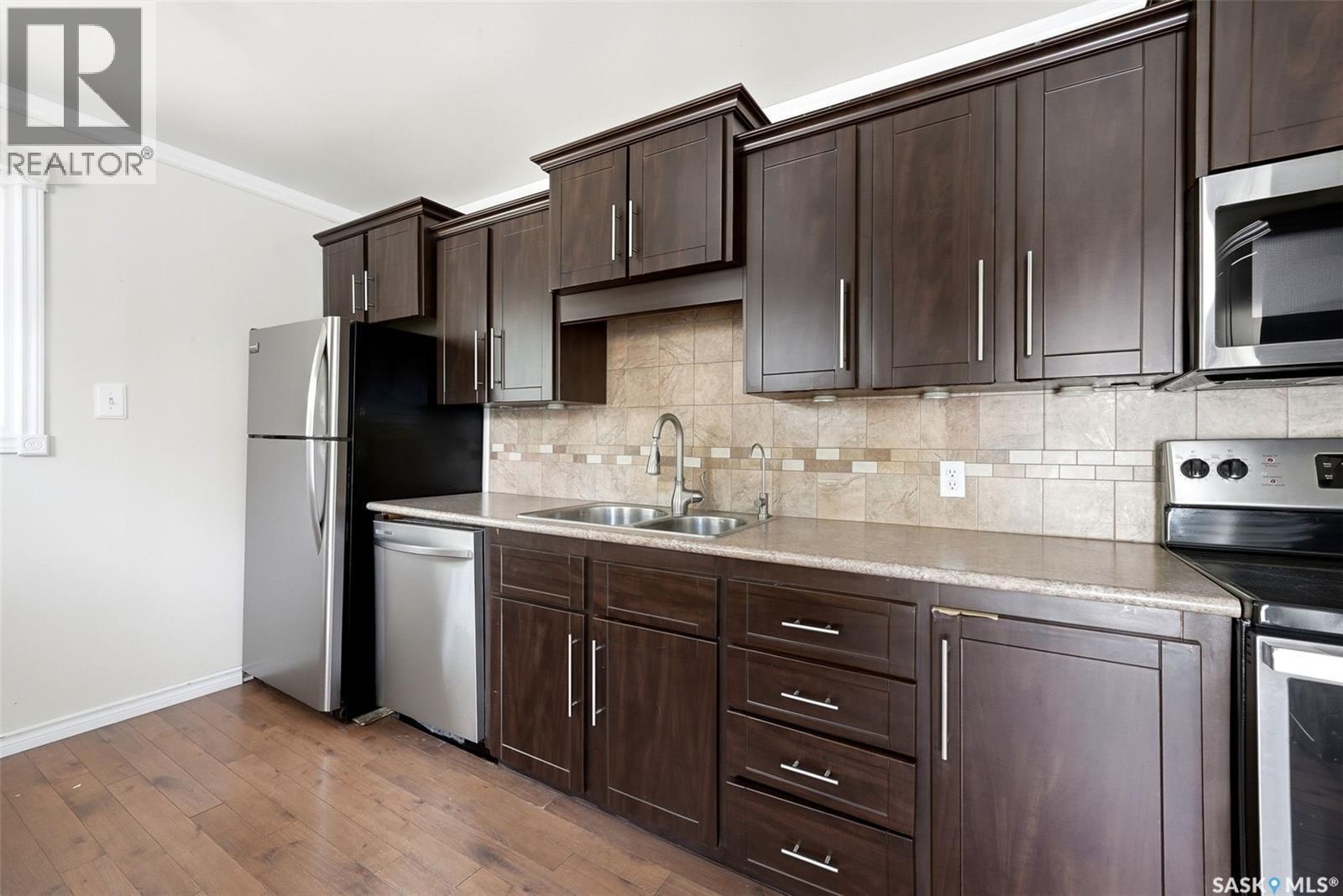 1410 4Th Avenue N, Regina, SK - Indoor Photo Showing Kitchen With Stainless Steel Kitchen With Double Sink