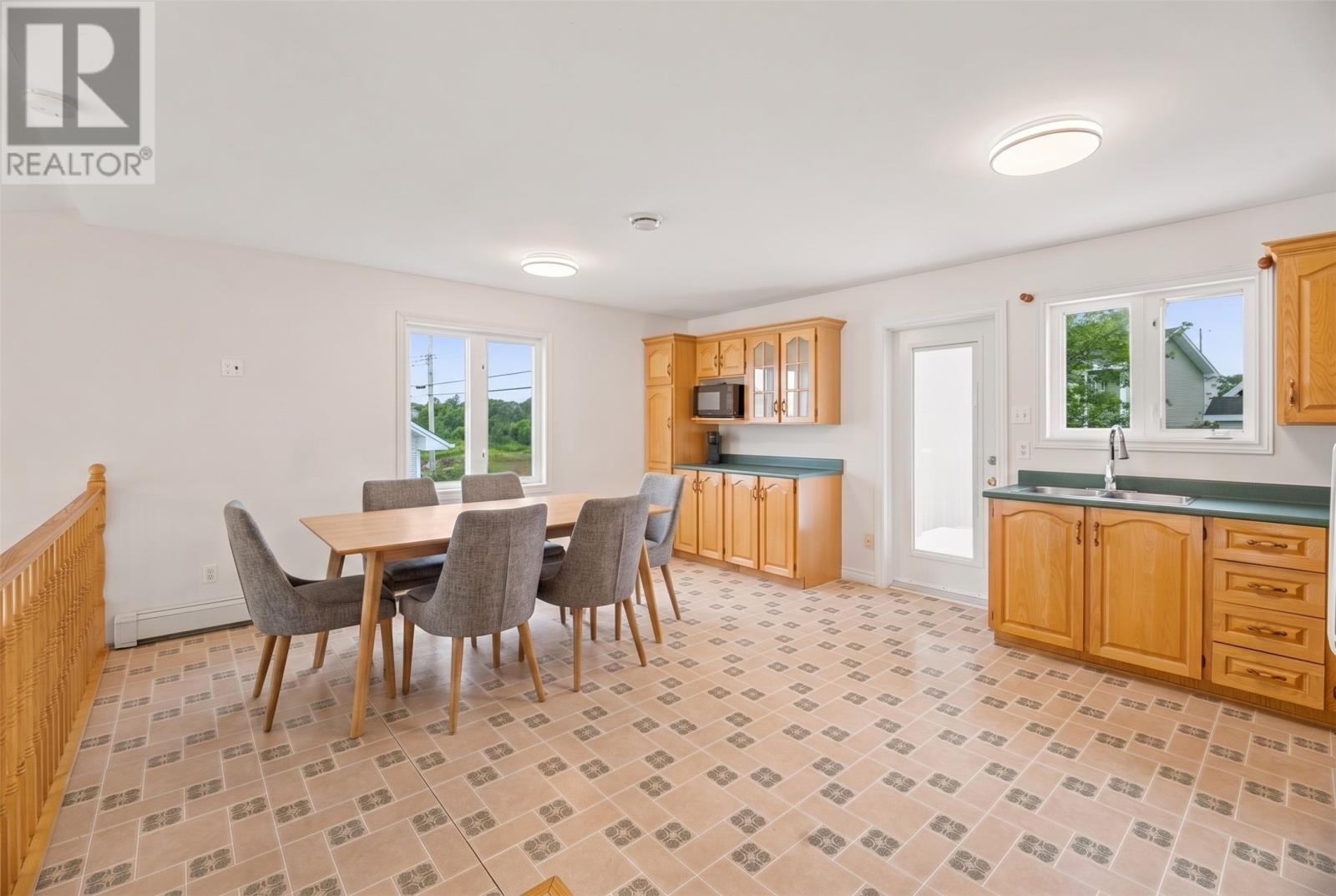 Large kitchen with plenty of cabinets and counter space, AI generated photo - 29 Elgin Drive, Paradise, NL