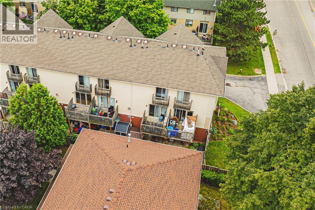 Rear exterior with multiple private balconies and mature perimeter trees - 266 Limeridge Road E Unit# 3, Hamilton, ON
