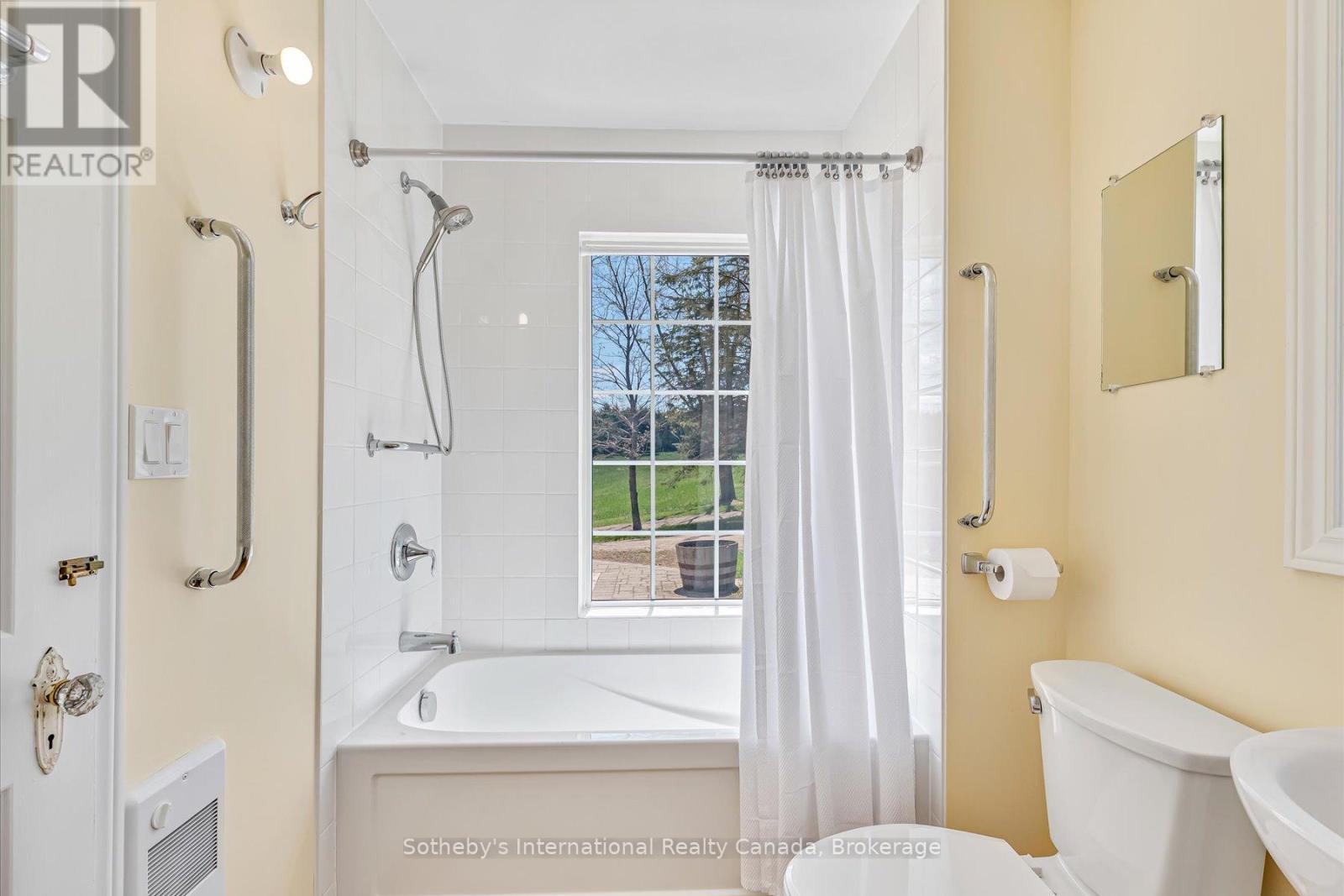 Main floor 4 piece bathroom and laundry - 717218 1St Line E Ehs, Mulmur, ON