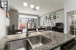 Kitchen island with granite countertop and double stainless-steel sink - 