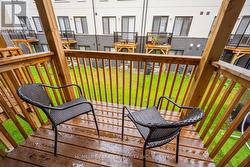 Walk out deck in fourth bedroom facing backyard - 