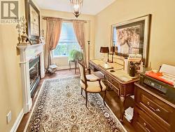Main floor office/den - with fireplace - 