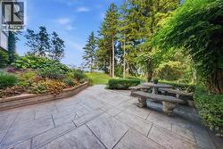 Stamped concrete patio with integrated stone seating - 
