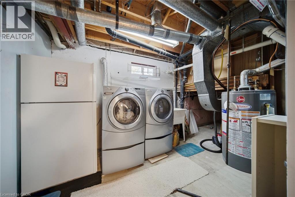 Dedicated laundry area featuring front-loading washer and dryer units - 2306 Devon Road, Oakville, ON