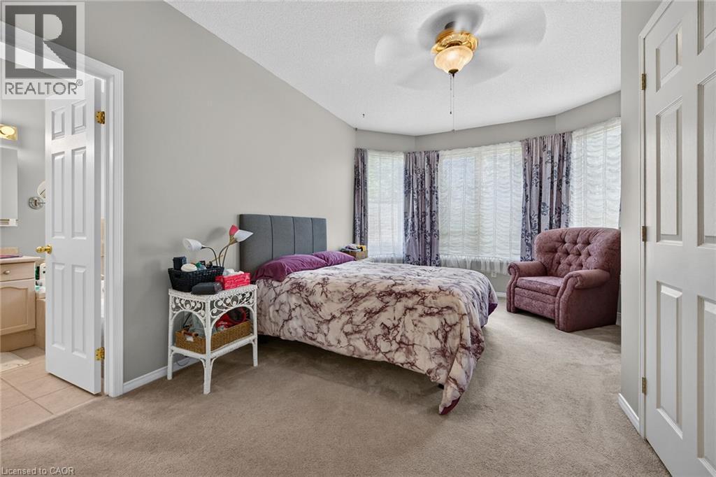 Primary bedroom with two closets and ensuite bathroom - 159 Thoroughbred Boulevard, Ancaster, ON