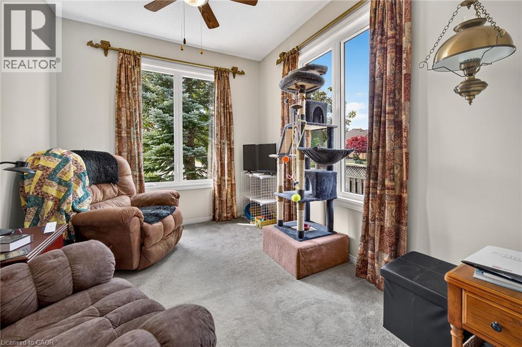 Bedroom with two windows and closet. - 159 Thoroughbred Boulevard, Ancaster, ON