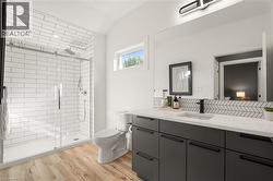 Walk-in shower with subway tile surround and sliding glass door - 