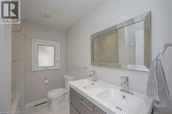 Dual vanity with integrated sinks, framed mirror, and chrome fixtures - 