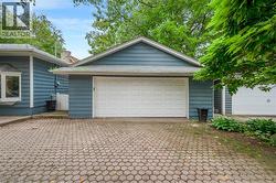 Two attached garages with white panel doors - 
