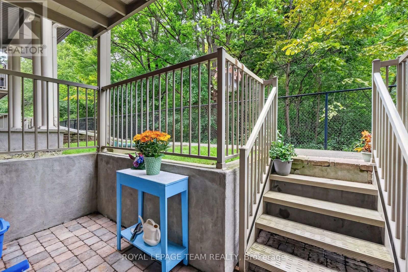 Surrounded by mature trees that provide privacy. - B - 1004 Beryl Private, Ottawa, ON