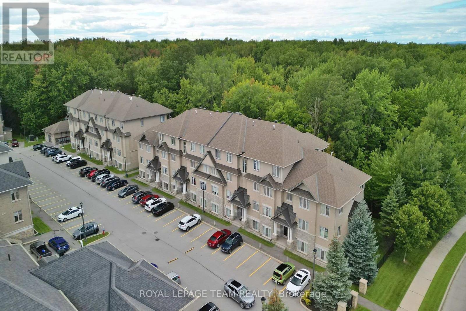 Surrounded by mature trees. - B - 1004 Beryl Private, Ottawa, ON
